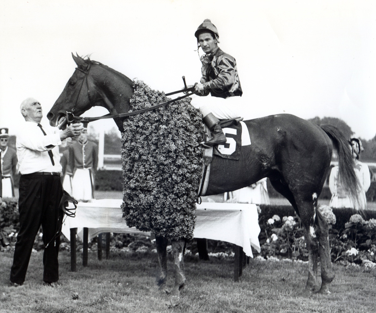Bill Shoemaker and Candy Spots in the winner's circle after winning the 1963 Jersey Derby at Garden State Park (Museum Collection)