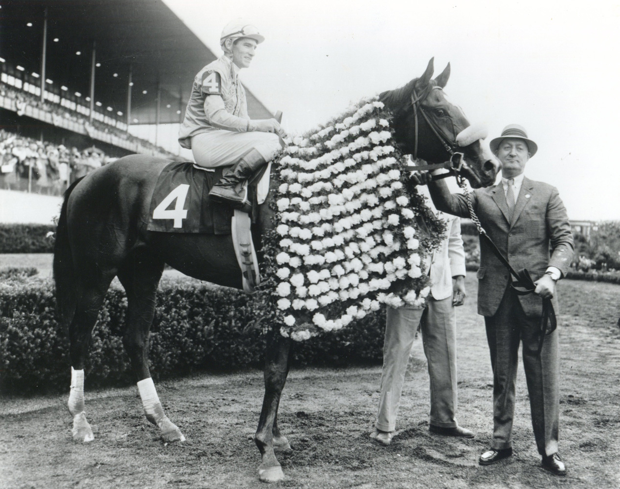 Paul Mellon and Quadrange, Manuel Ycaza up, in the winner's circle for the 1964 Belmont Stakes at Aqueduct (Museum Collection)