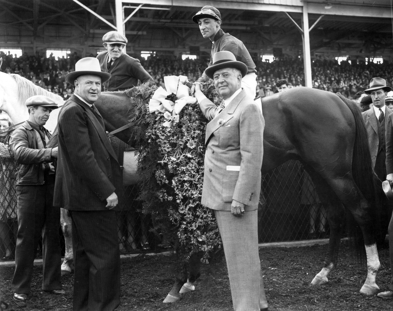 Trainer Ben Jones with Whirlaway (Eddie Arcaro up) and owner Warren Wright in the winner's circle for the 1941 Preakness Stakes at Pimlico (Keeneland Library Morgan Collection/Museum Collection)