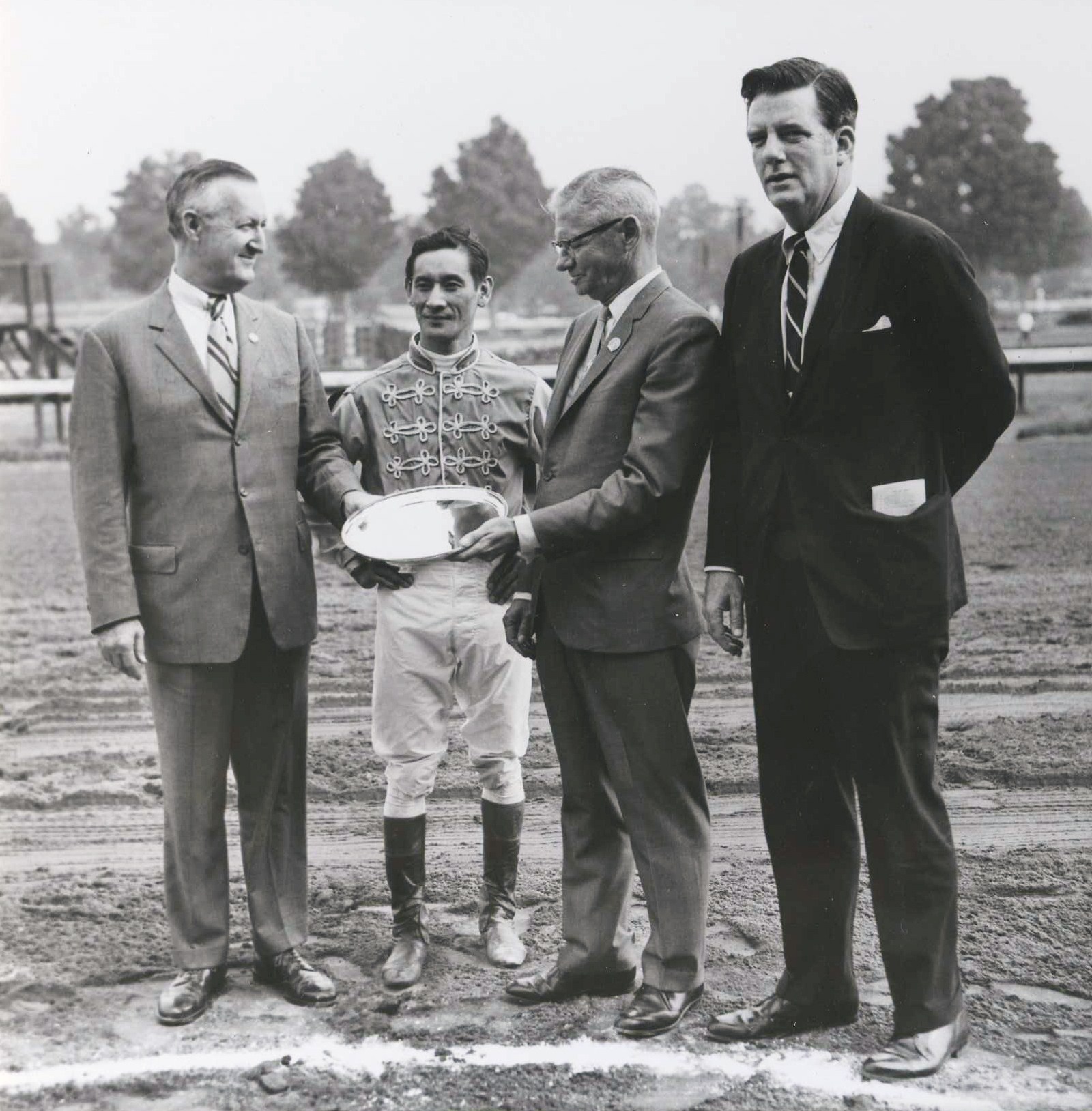 From left, Paul Mellon, Braulio Baeza, the Honorable William L. Pfeiffer, and Elliott Burch at Saratoga for winner's circle presentation after Arts and Letters' Jim Dandy Stakes victory, Aug. 8, 1969 (Museum Collection)