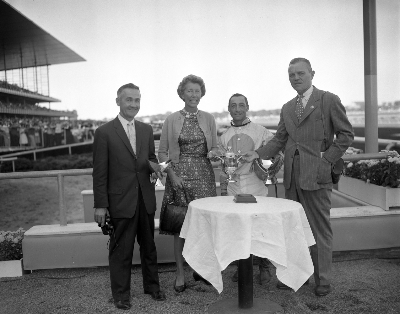 Carl Hanford, Allaire du Ppont, Eddie Arcaro, R. Strawbridge, Jr. at the trophy presentation for Kelso's 1960 Jerome Handicap win at Aqueduct (Keeneland Library Morgan Collection)
