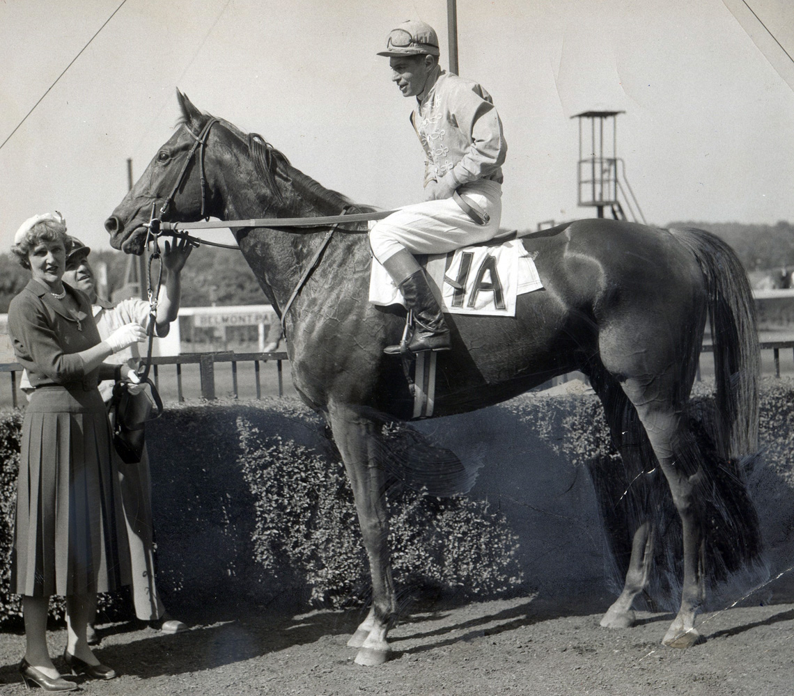 Jockey Flint S. "Scotty" Schulhofer and Neji in the winner's circle for the 1955 International Steeplechase at Belmont Park (Bert Morgan/Museum Collection)