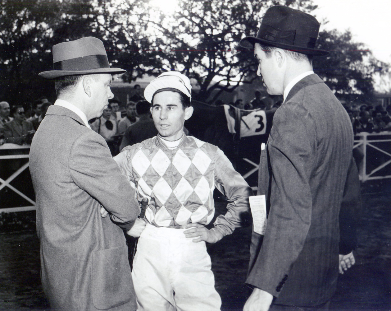 Trainer William C. Winfrey, jockey Eric Guerin, and owner Alfred G. Vanderbilt II in the Santa Anita paddock, circa 1952 (Bill Mochon/Museum Collection)