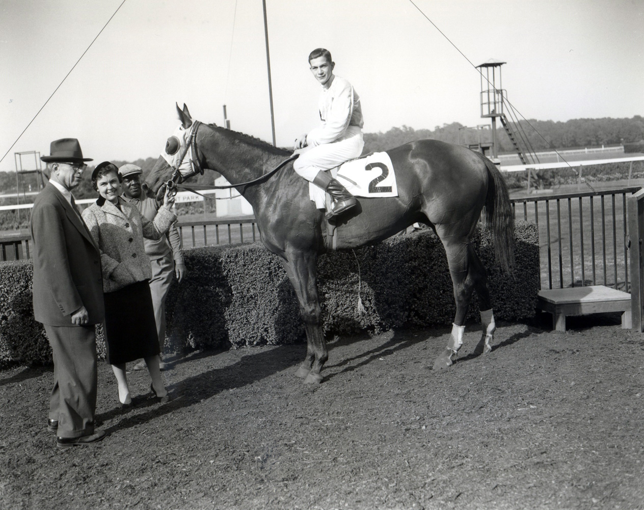 G. Carey Winfrey joining Dedicate (Bill Hartack up) in the winner's circle for the 1957 Woodward Stakes at Belmont Park (Keeneland Library Morgan Collection/Museum Collection)